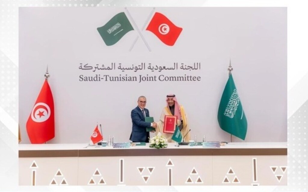 Officials discussing investment and strategic partnerships in a meeting.