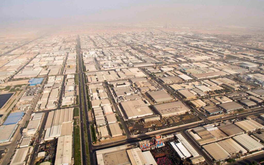 Aerial view of multiple factory buildings in an industrial area.